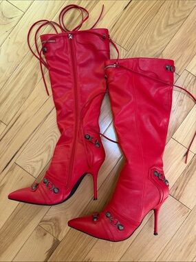 Red Stiletto Knee-High Boots with Decorative Hardware